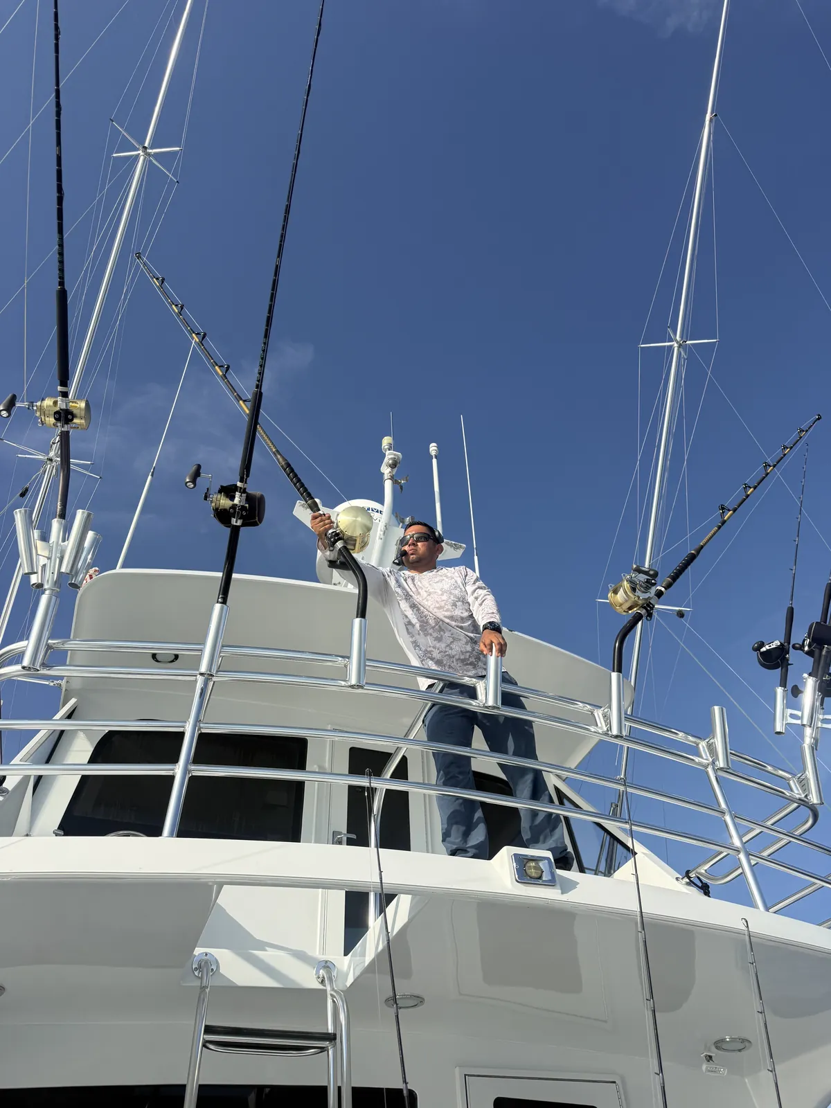 Looking up at the flybridge and outriggers of the 65 foot Hatteras